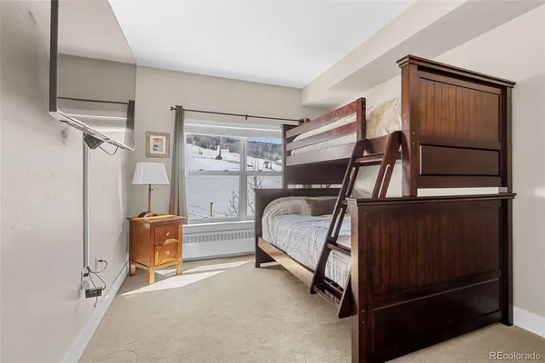 a bedroom with table and chairs