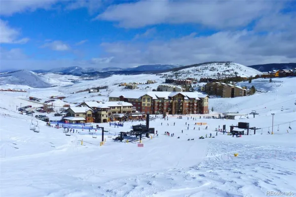a view of a swimming pool with outdoor seating