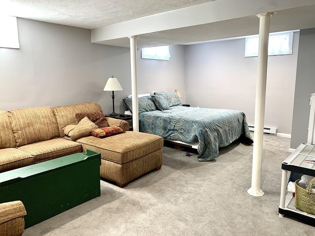 635 Townsend Road Groton, MA 01450 - Photo 29 of 40 a living room with furniture and a lamp