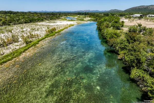 a view of lake with green space