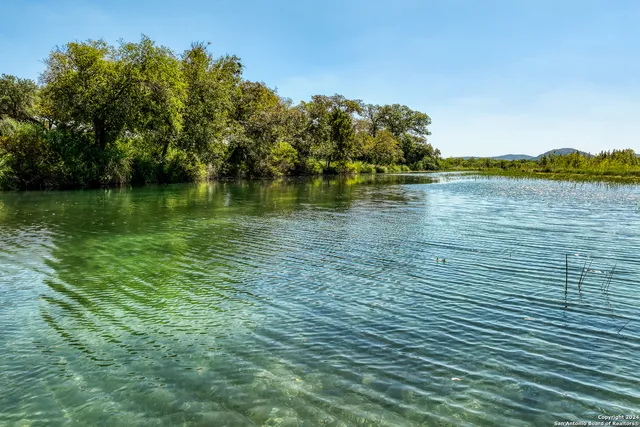 a view of a lake with mountains in the background