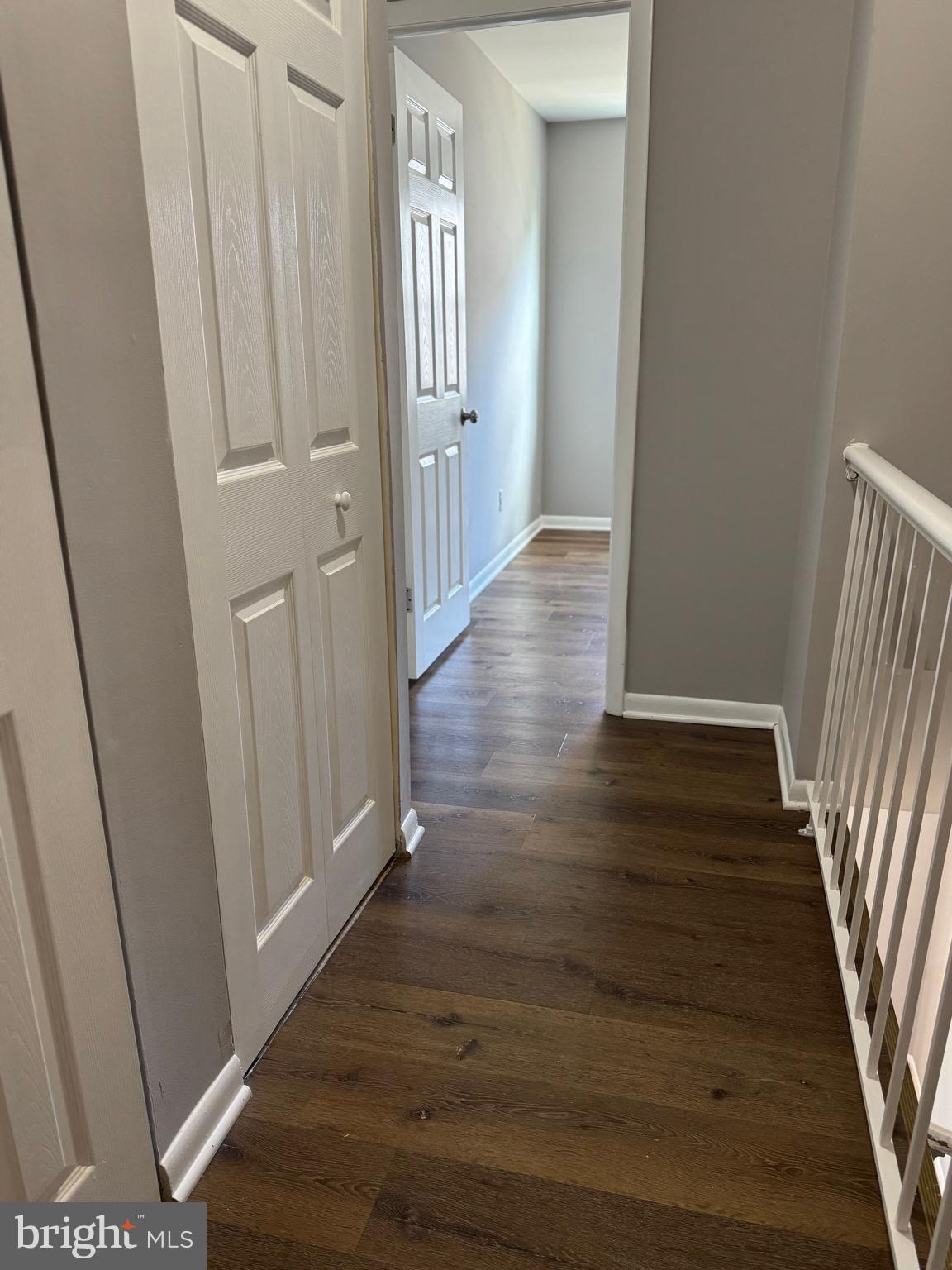 19970 Appledowre Circle, Unit 404 Germantown, MD 20876 - Photo 7 of 15 a view of a hallway with wooden floor