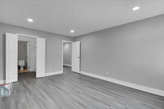 a bathroom with a toilet and a vanity