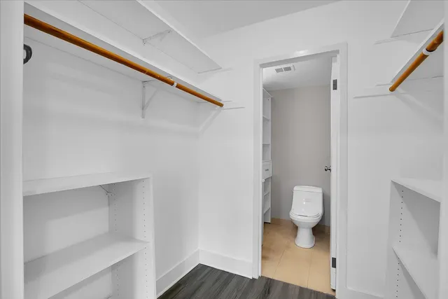 a bathroom with a sink toilet and vanity