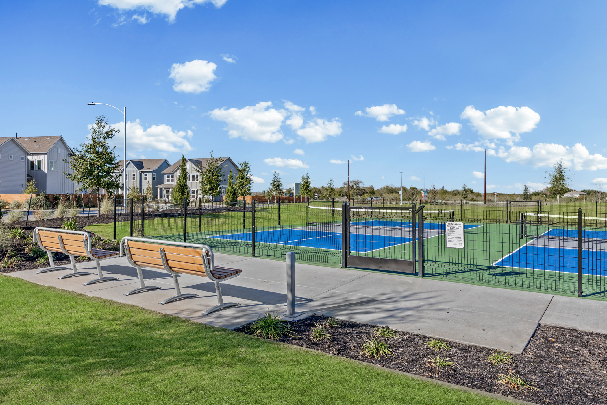 5806 Rangeland Road Austin, TX 78747 - Photo 31 of 34 Engage in friendly competition on the well-maintained community pickleball courts, steps from neighborhood residences.