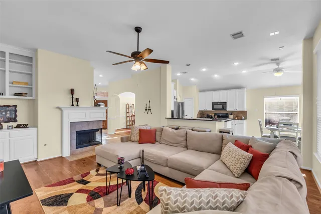 a living room with furniture and a fireplace