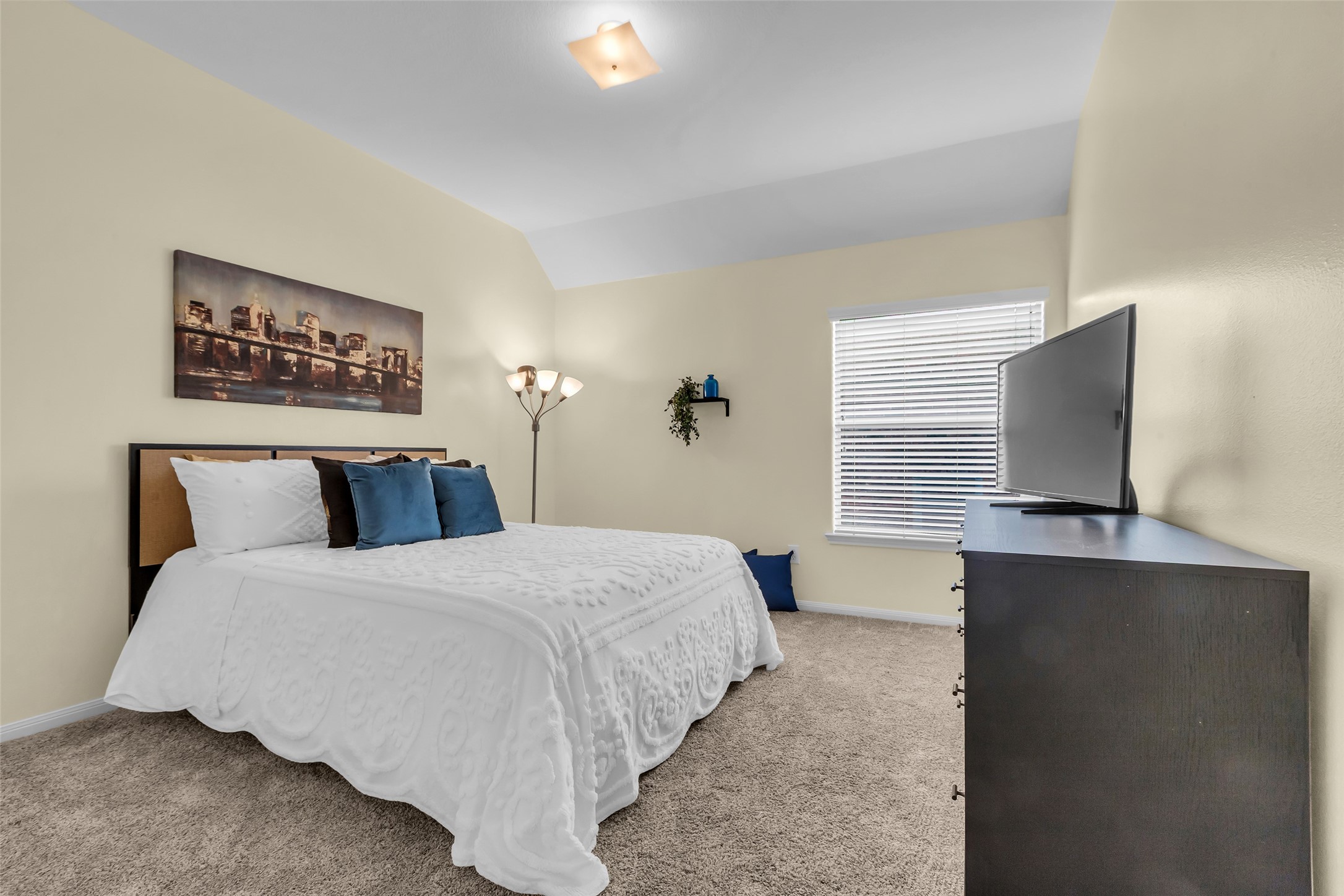 6311 Stone Hill Road Spring, TX 77389 - Photo 18 of 26 a bedroom with a large bed and tv