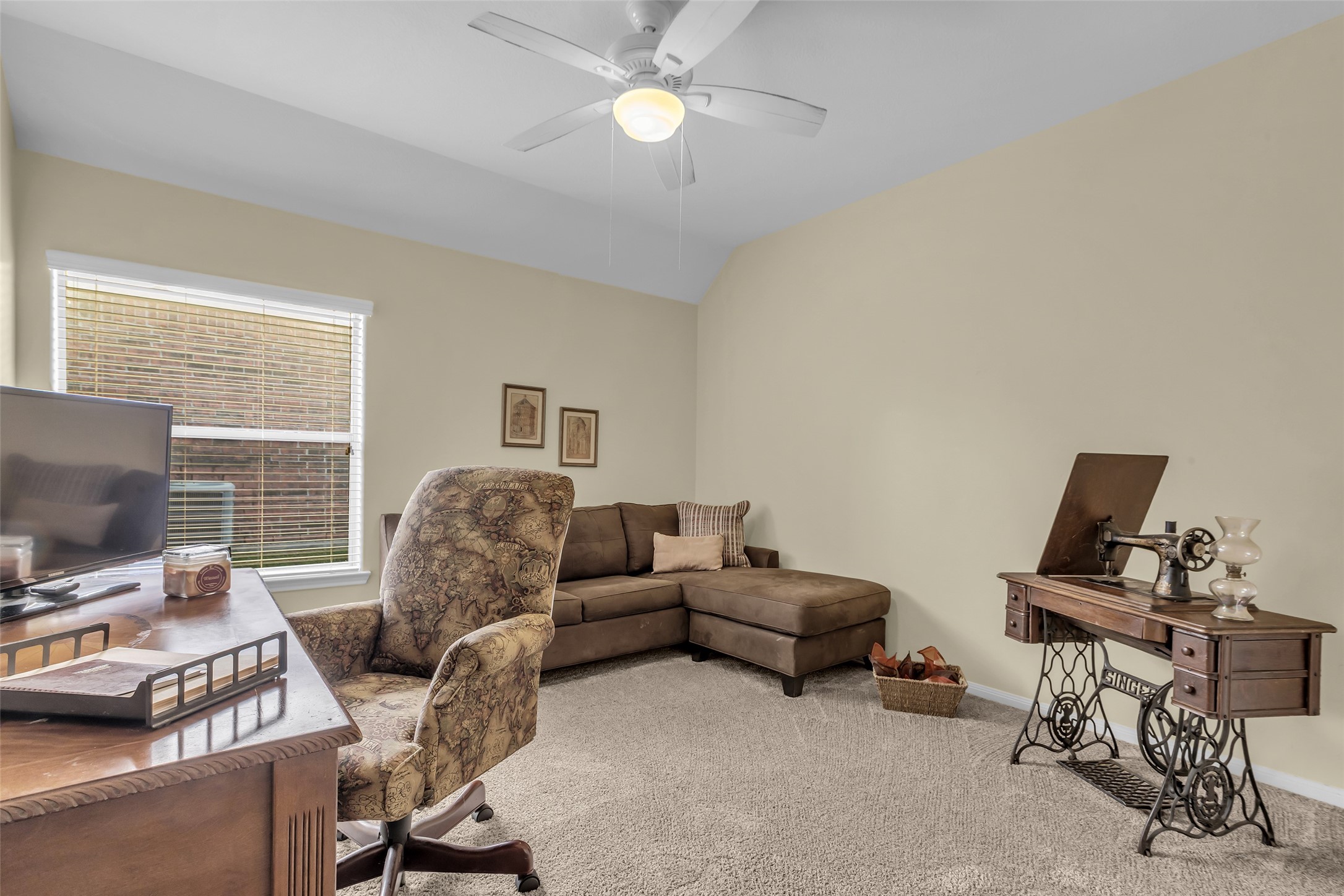 6311 Stone Hill Road Spring, TX 77389 - Photo 19 of 26 a living room with furniture a flat screen tv and a window