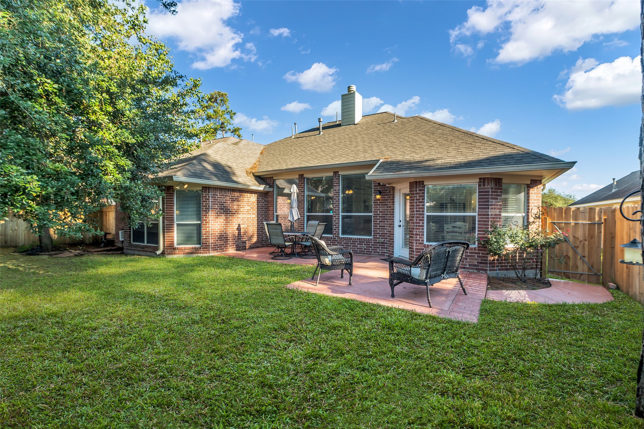 6311 Stone Hill Road Spring, TX 77389 - Photo 22 of 26 a view of a house with a backyard porch and sitting area