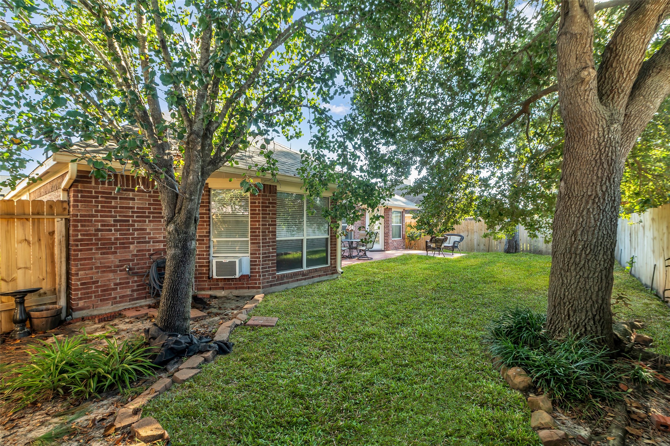 6311 Stone Hill Road Spring, TX 77389 - Photo 23 of 26 a view of a yard in front of a house with large trees