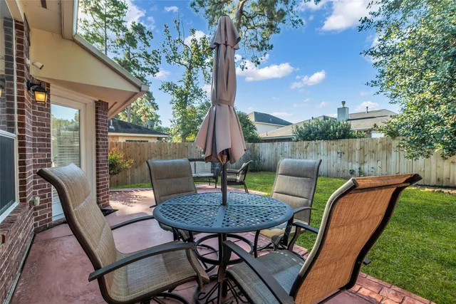 a view of a patio in the backyard