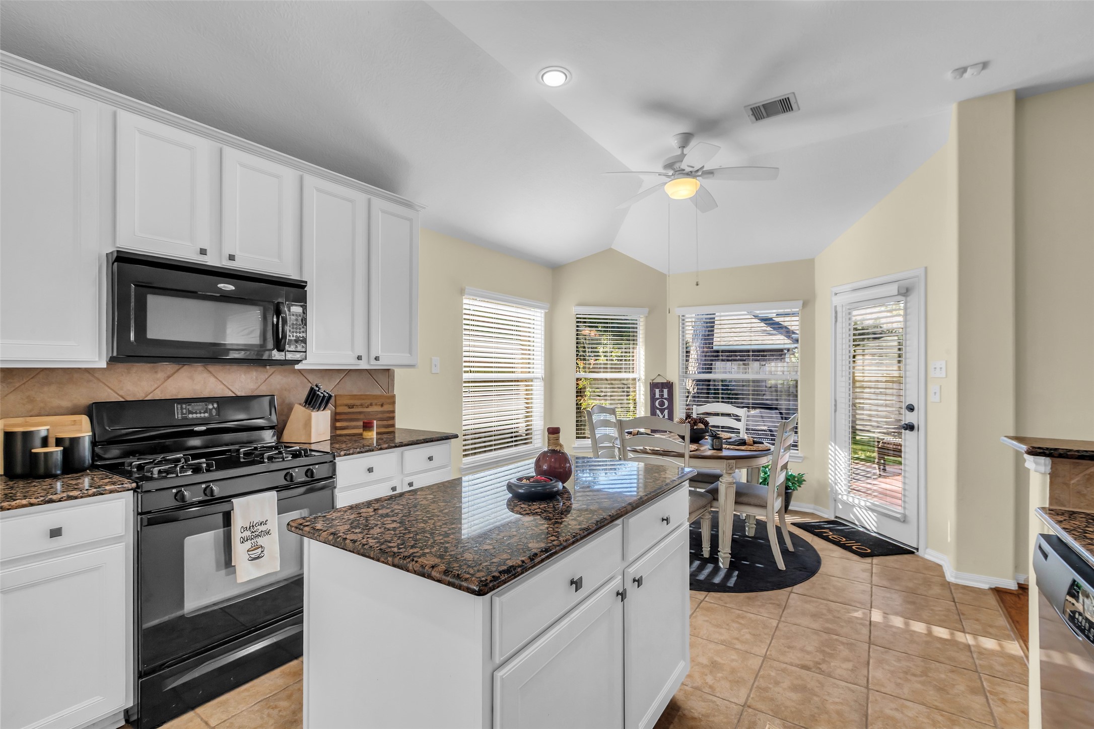 6311 Stone Hill Road Spring, TX 77389 - Photo 9 of 26 a kitchen with a sink stove and cabinets