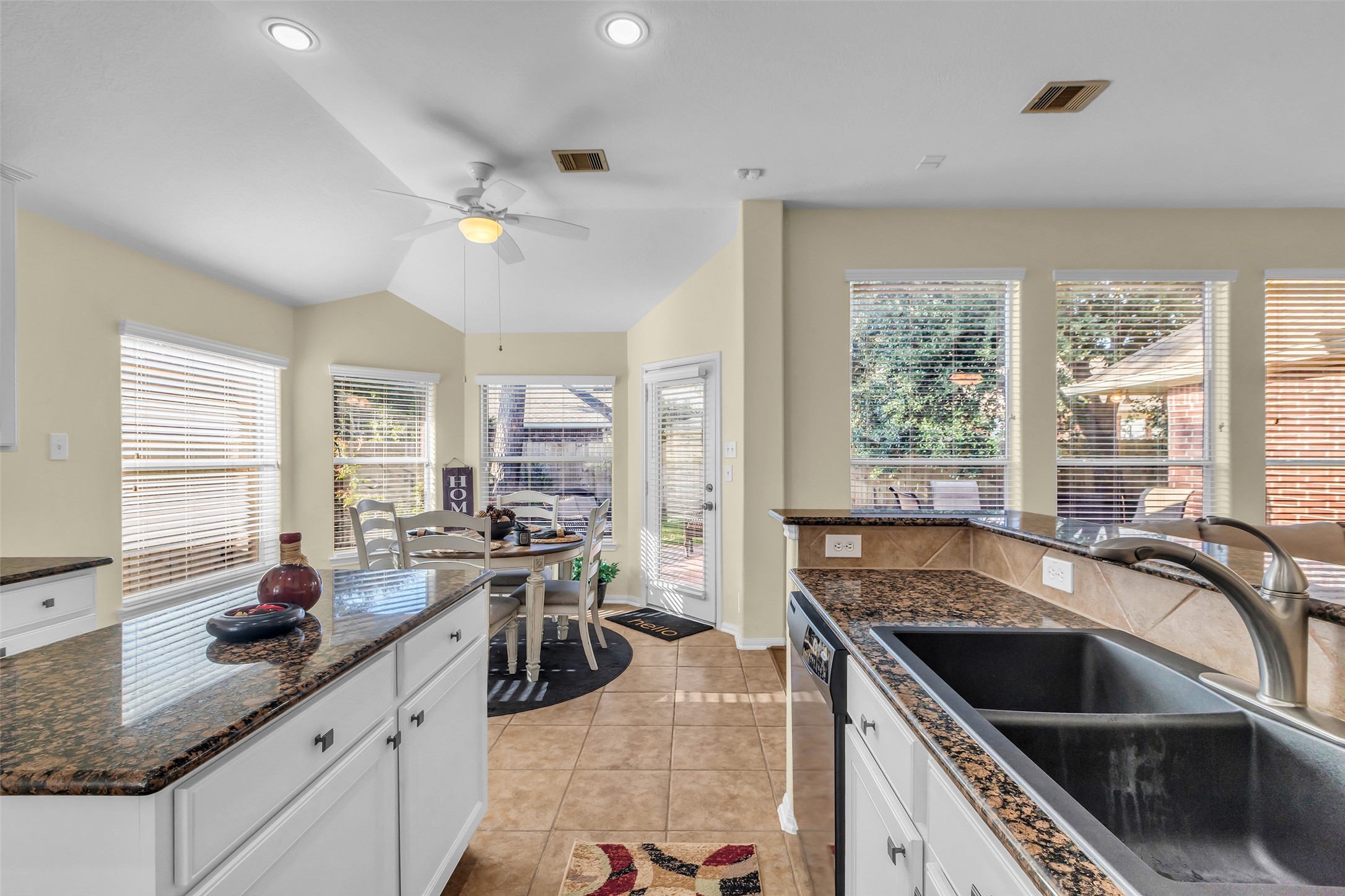 6311 Stone Hill Road Spring, TX 77389 - Photo 10 of 26 a kitchen with a stove sink and cabinets