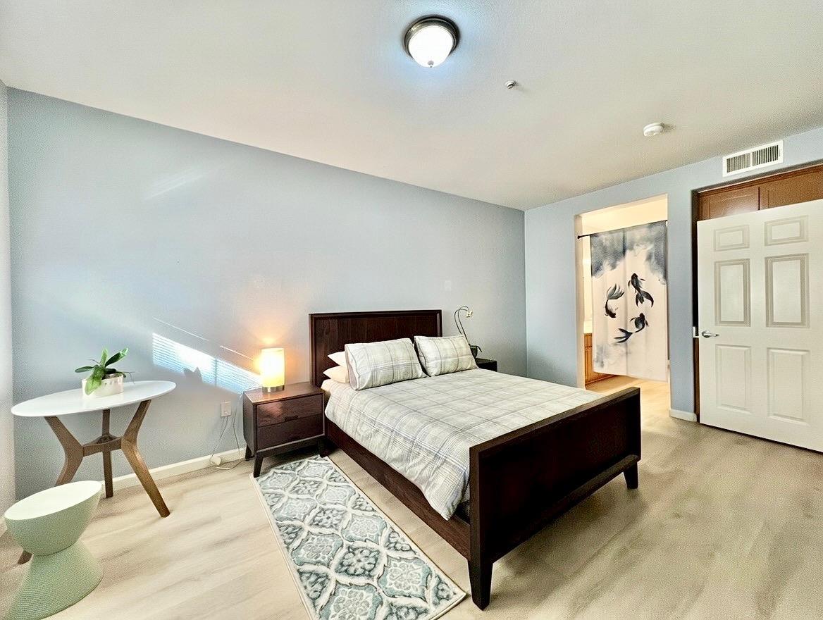 1310 Saddle Rack Street, Unit 347 San Jose, CA 95126 - Photo 16 of 42 a bedroom with a bed and table chair