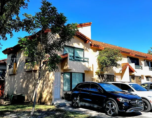 a car parked in front of a house