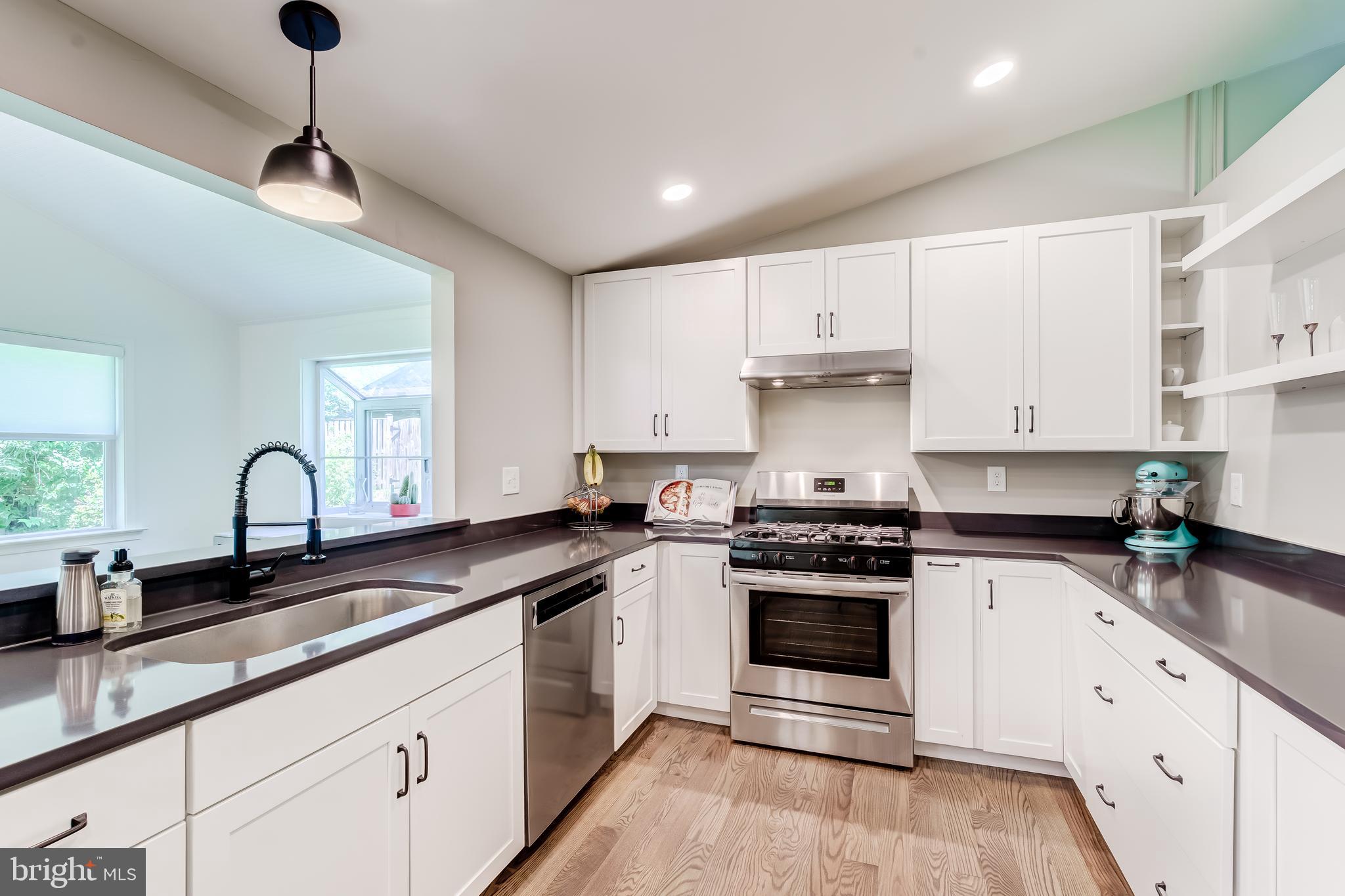 11926 Appling Valley Road Fairfax, VA 22030 - Photo 2 of 60 a kitchen with cabinets stainless steel appliances a sink and a window