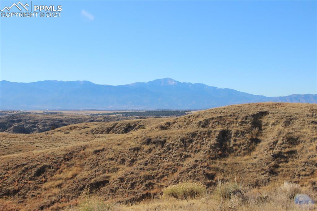 2907 Solberg Court Peyton, CO 80831 - Photo 13 of 14 a view of a large mountain with mountains in the background