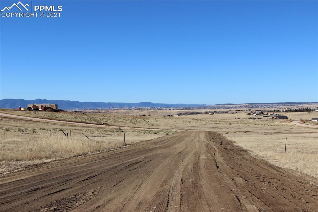 2907 Solberg Court Peyton, CO 80831 - Photo 7 of 14 a view of an ocean and beach