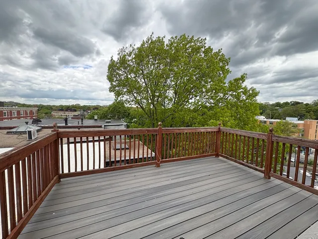 a view of deck with wooden floor and fence