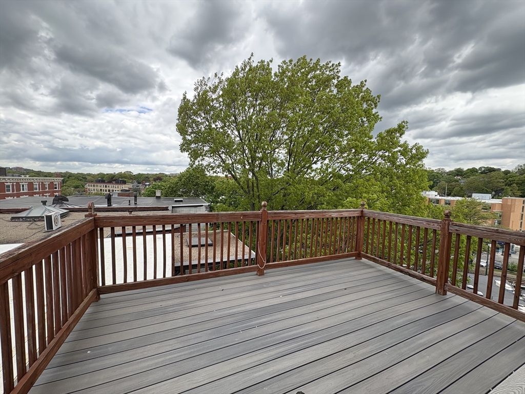 a view of deck with wooden floor and fence