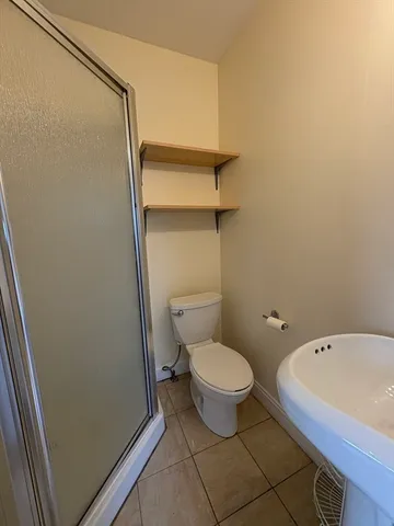 a bathroom with a toilet and a tub