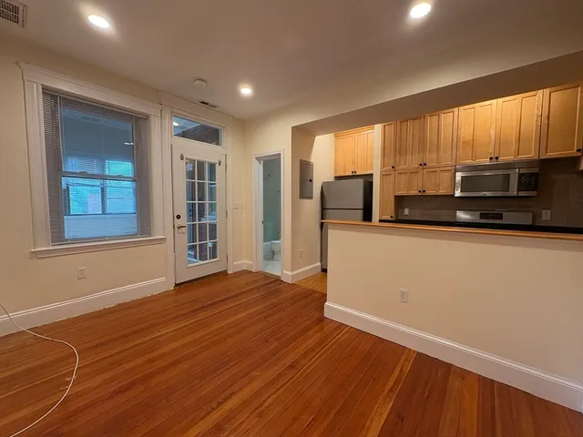 a view of a kitchen with a sink and a microwave