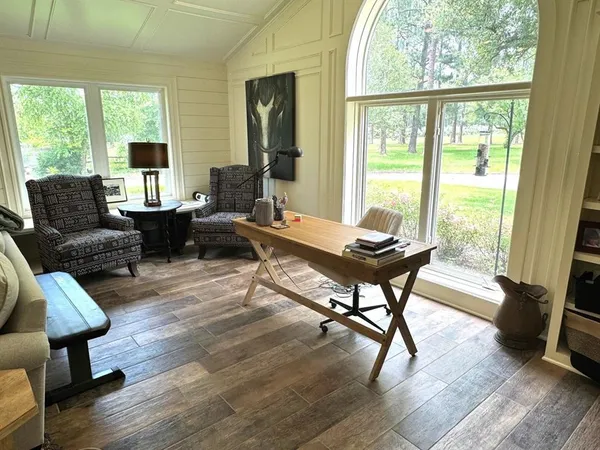 a living room with furniture and a window