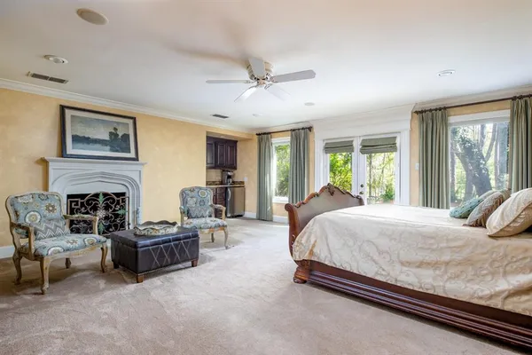 a bedroom with bed and furniture