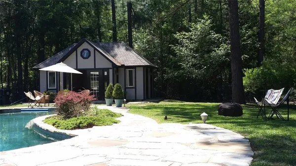 a front view of a house with garden