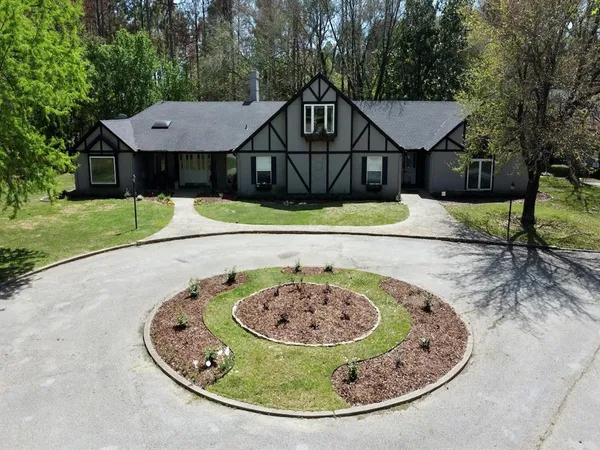 a view of a house with a swimming pool side view