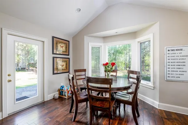 a view of a dining room with furniture window and wooden floor