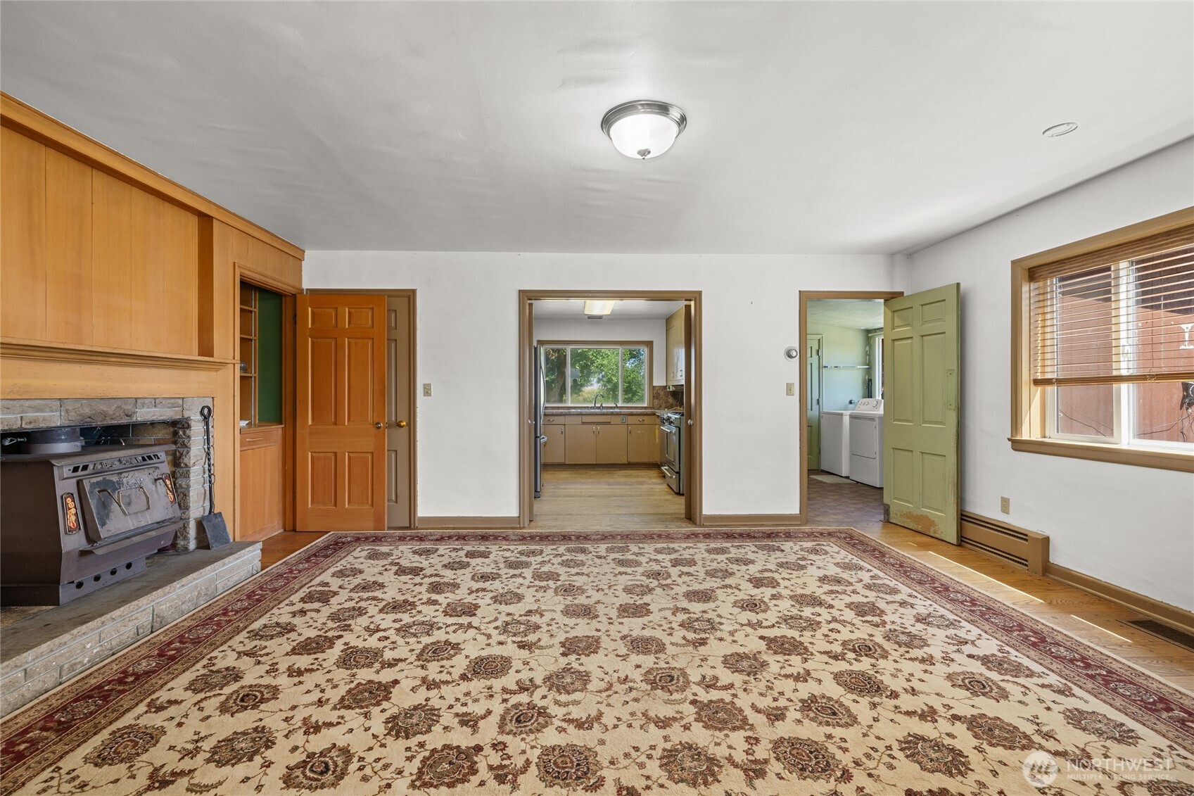 4530 Weaver Road Ellensburg, WA 98926 - Photo 11 of 39 a view of a livingroom with wooden floor and a fireplace