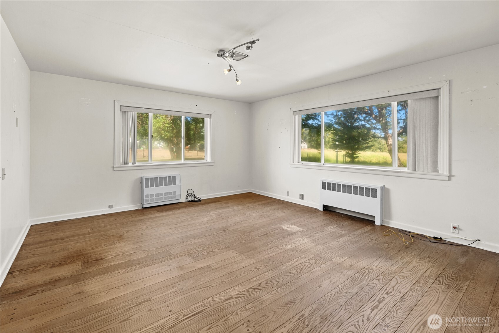 4530 Weaver Road Ellensburg, WA 98926 - Photo 18 of 39 a view of an empty room with a window and wooden floor