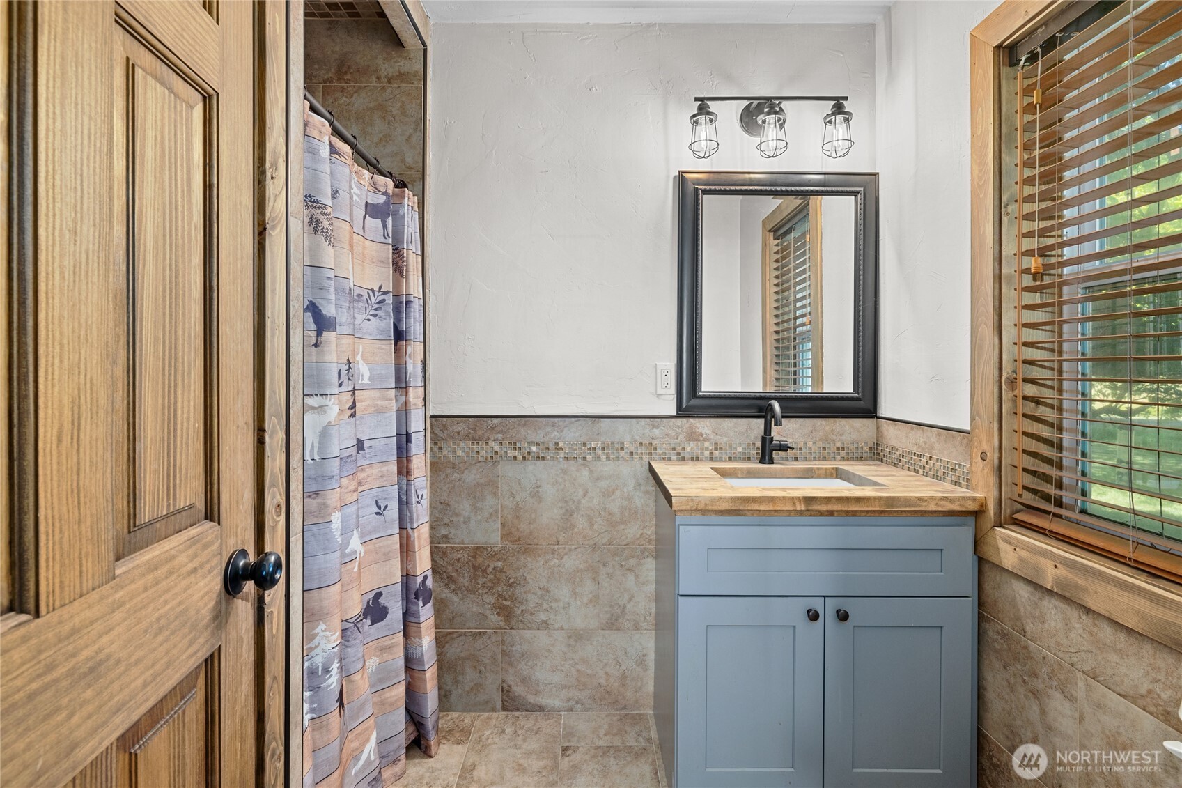 4530 Weaver Road Ellensburg, WA 98926 - Photo 29 of 39 a bathroom with a granite countertop sink and a mirror