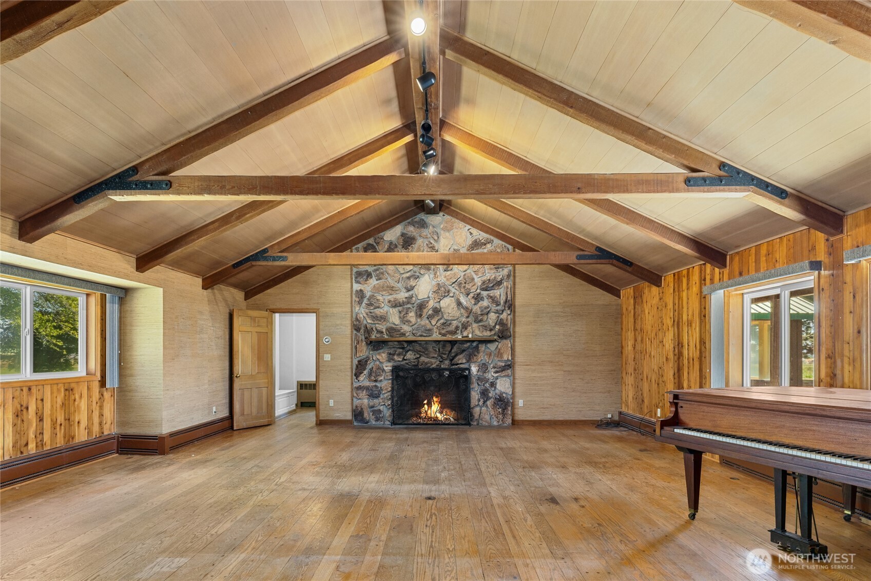 4530 Weaver Road Ellensburg, WA 98926 - Photo 6 of 39 a view of an empty room with a fireplace and a window