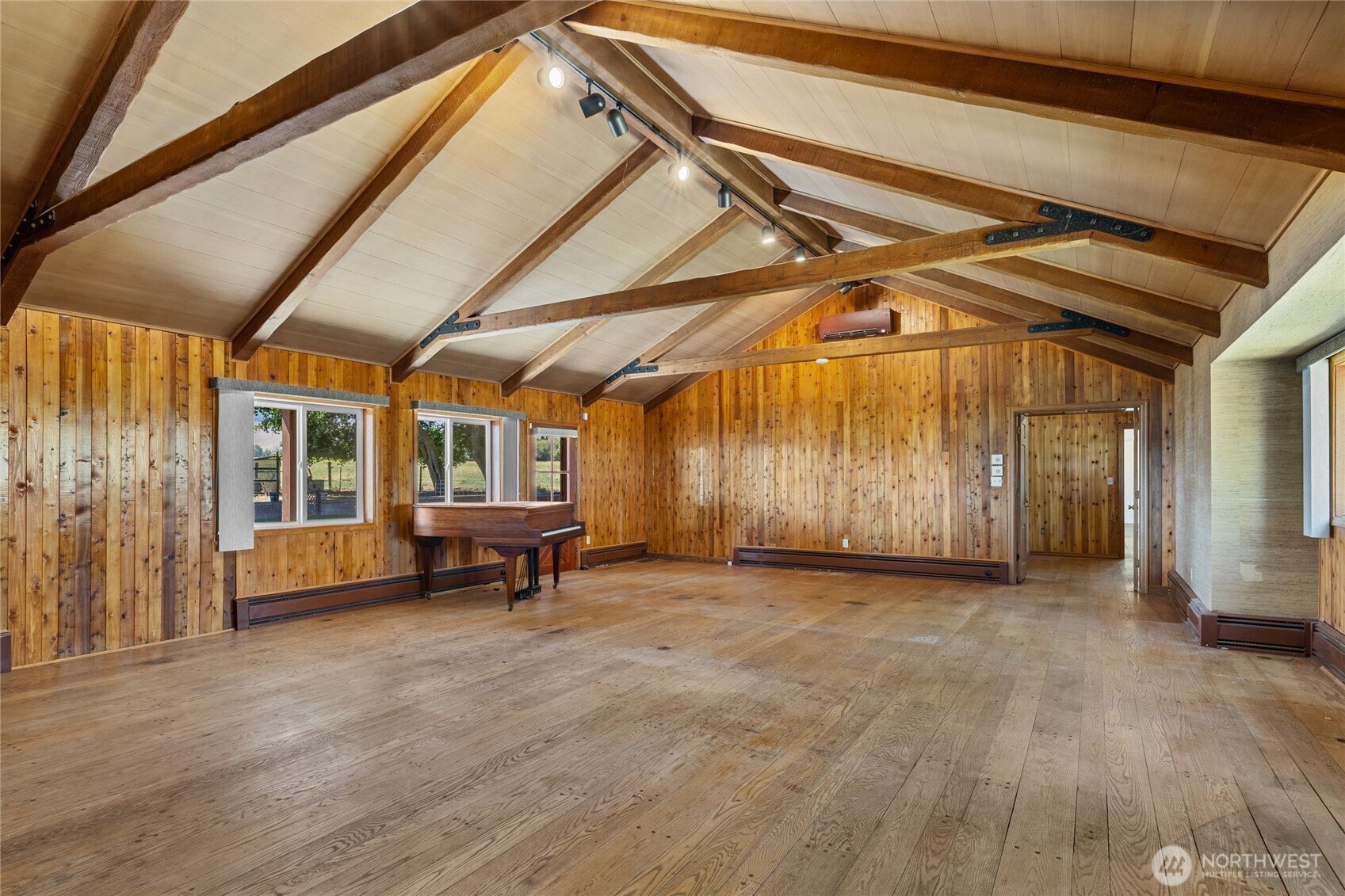 4530 Weaver Road Ellensburg, WA 98926 - Photo 7 of 39 a view of an empty room with wooden floor and a window