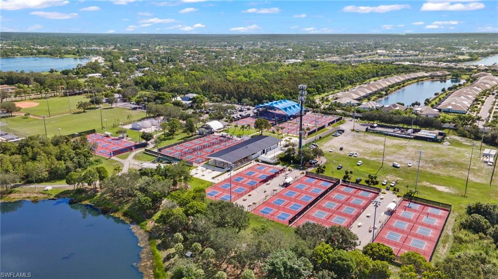 4718 Normandy Drive Naples, FL 34112 - Photo 12 of 14 an aerial view of residential houses with outdoor space