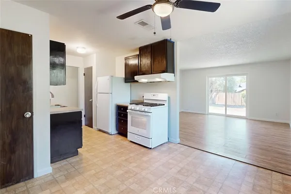 a view of a kitchen with a sink and a stove top oven