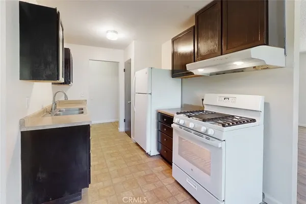 a kitchen with a stove and a sink
