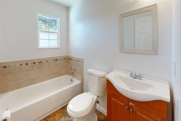 a bathroom with a sink toilet and bathtub