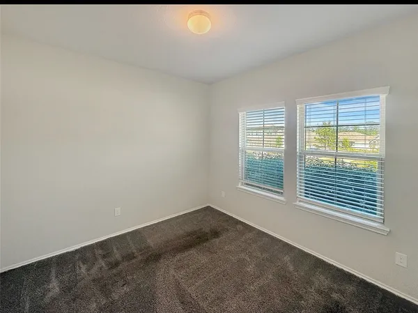 a view of a room that has a window in it