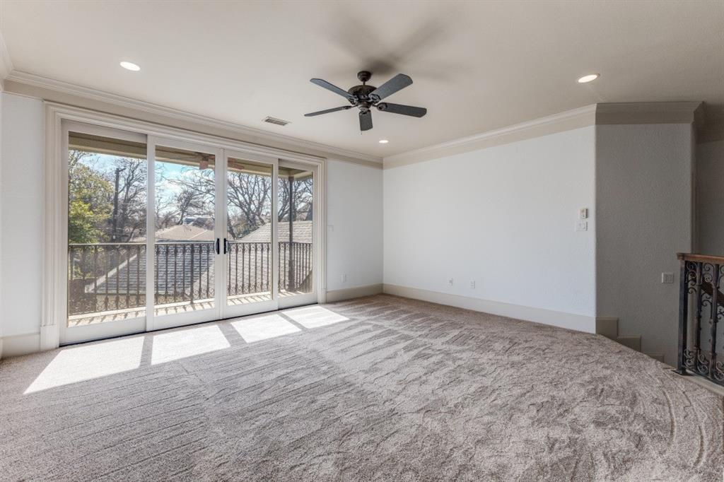 6416 Dykes Way Dallas, TX 75230 - Photo 22 of 37 an empty room with wooden floor and windows