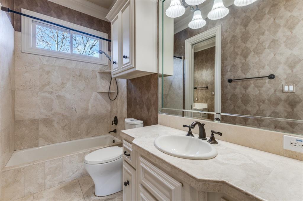 6416 Dykes Way Dallas, TX 75230 - Photo 23 of 37 a bathroom with a sink toilet and shower