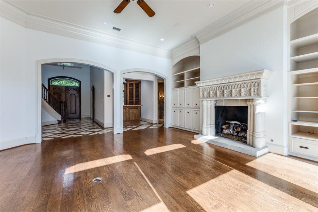 6416 Dykes Way Dallas, TX 75230 - Photo 35 of 37 a view of a livingroom with a fireplace and window