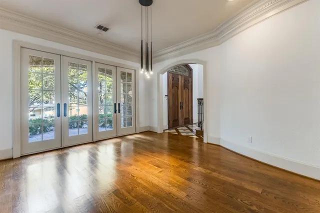 a view of room with window and hardwood floor