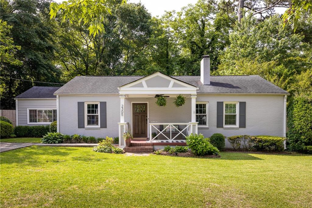 2305 Sanford Road Decatur, GA 30033 - Photo 1 of 1 a front view of house with yard and outdoor seating