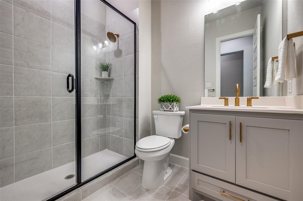 6333 Hedgecoxe Road The Colony, TX 75056 - Photo 14 of 25 Full downstairs bathroom with large walk-in shower.