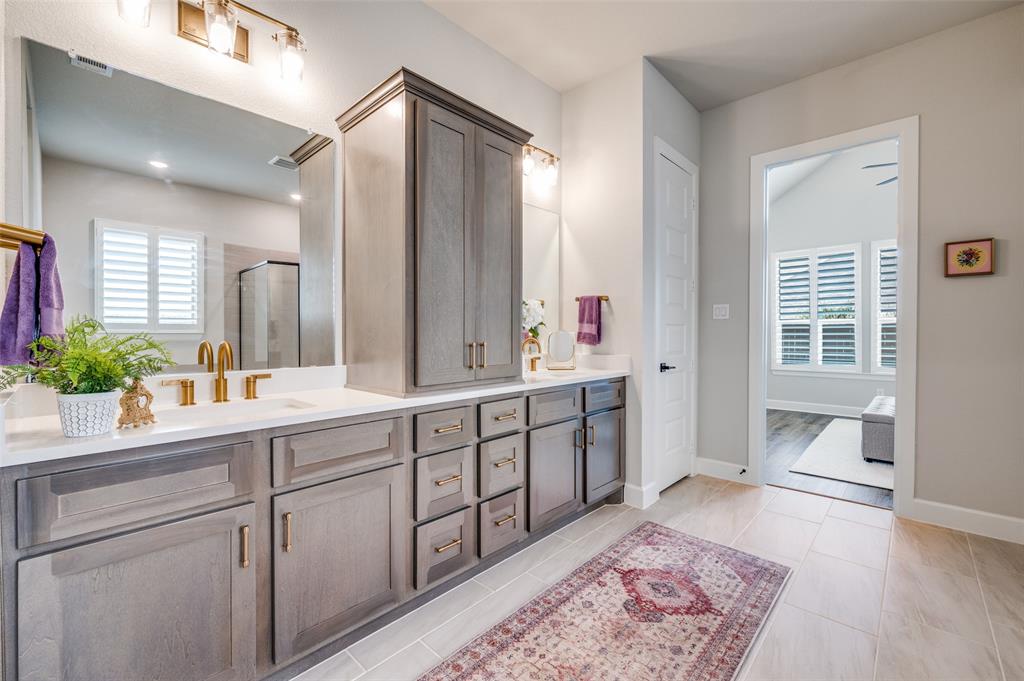 6333 Hedgecoxe Road The Colony, TX 75056 - Photo 17 of 25 Ensuite bathroom features double vanity with abundant storage