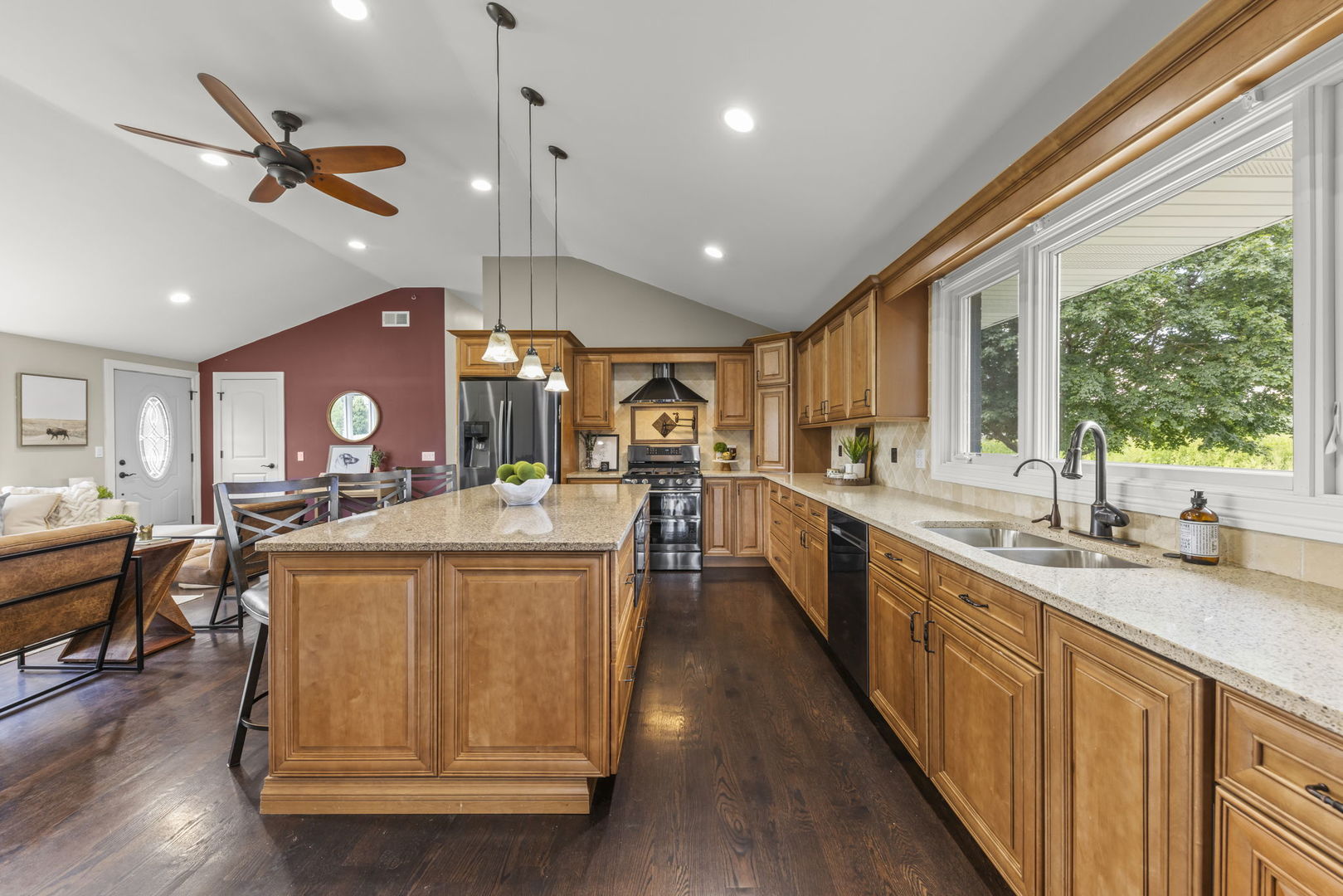 10N862 Muirhead Road Elgin, IL 60124 - Photo 16 of 47 a large kitchen with stainless steel appliances kitchen island granite countertop a large center island attached withe living room