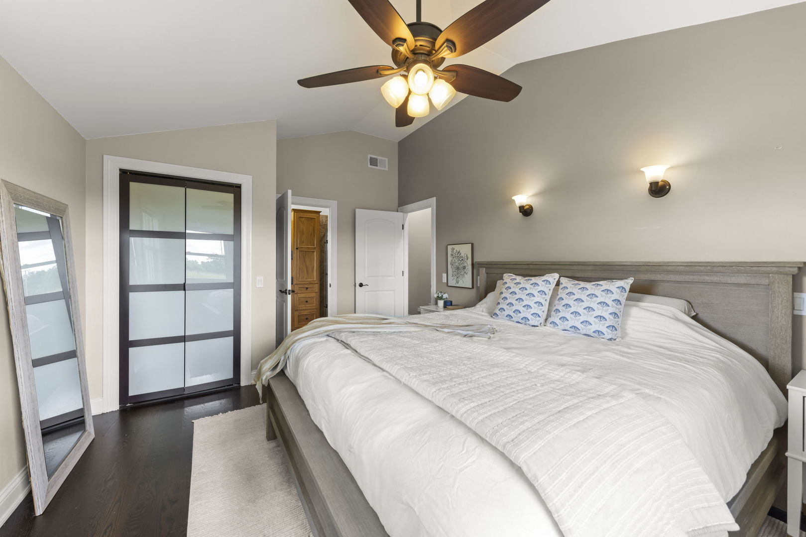 10N862 Muirhead Road Elgin, IL 60124 - Photo 21 of 47 a bedroom with a large bed and a chandelier